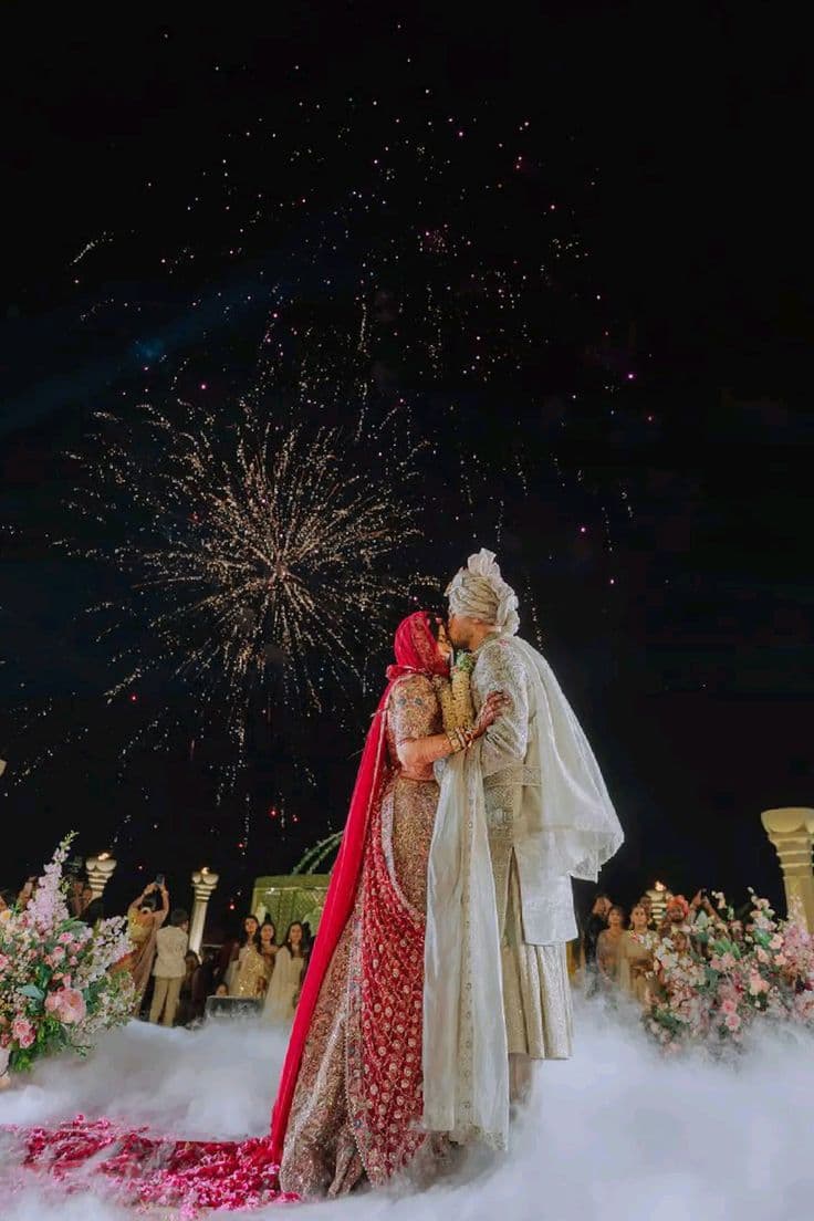 Bride and groom under fireworks